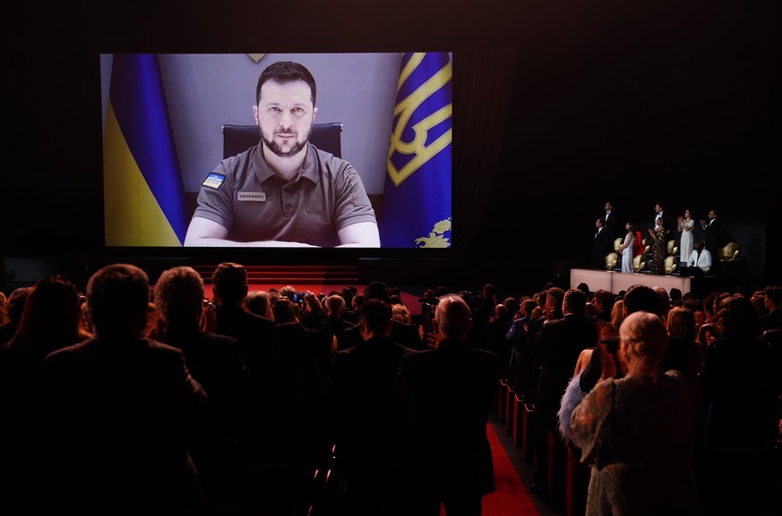 epa09953399 Ukraine&#039;s President Volodymyr Zelensky appears on a screen during the Opening Ceremony of the 75th annual Cannes Film Festival, in Cannes, France, 17 May 2022. The festival runs from  ...