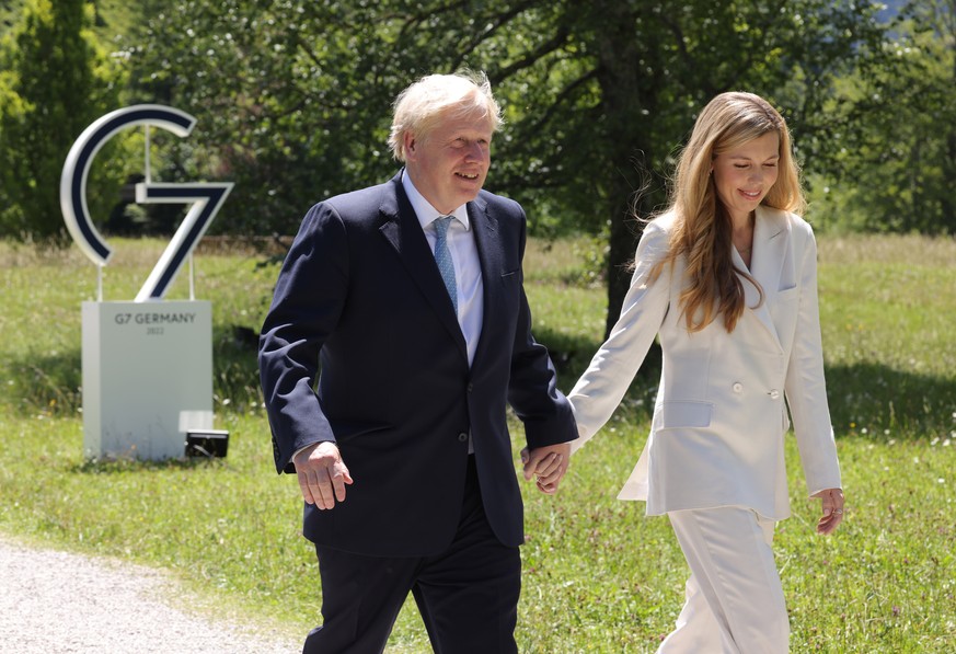 epa10034858 British Prime Minister Boris Johnson (L) and his wife Carrie Johnson attend the first day of the G7 summit at Schloss Elmau near Garmisch-Partenkirchen, Germany, 26 June 2022. Leaders of t ...