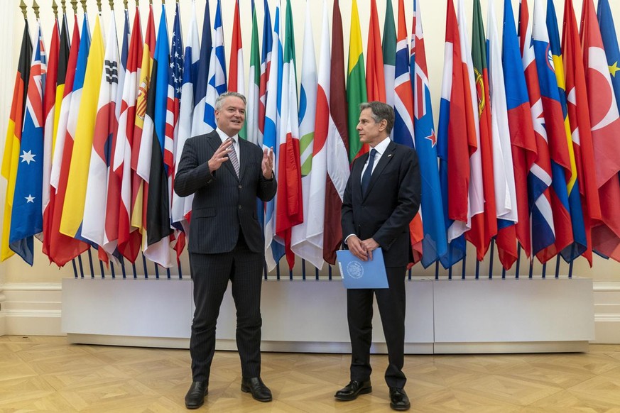 US Secretary-General of the Organization for Economic Cooperation and Development (OECD) Mathias Cormann, of Australia, left, accompanied by US Secretary of State Antony Blinken, speaks at the OECD he ...