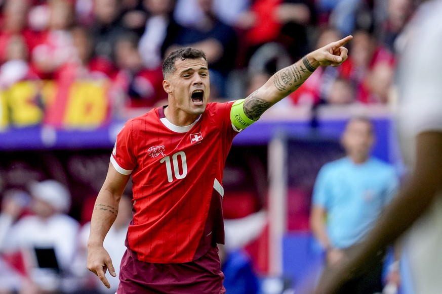 =Switzerland's Granit Xhaka gestures during a quarterfinal match between England and Switzerland at the Euro 2024 soccer tournament in Duesseldorf, Germany, Saturday, July 6, 2024. (AP Photo/Dark ...