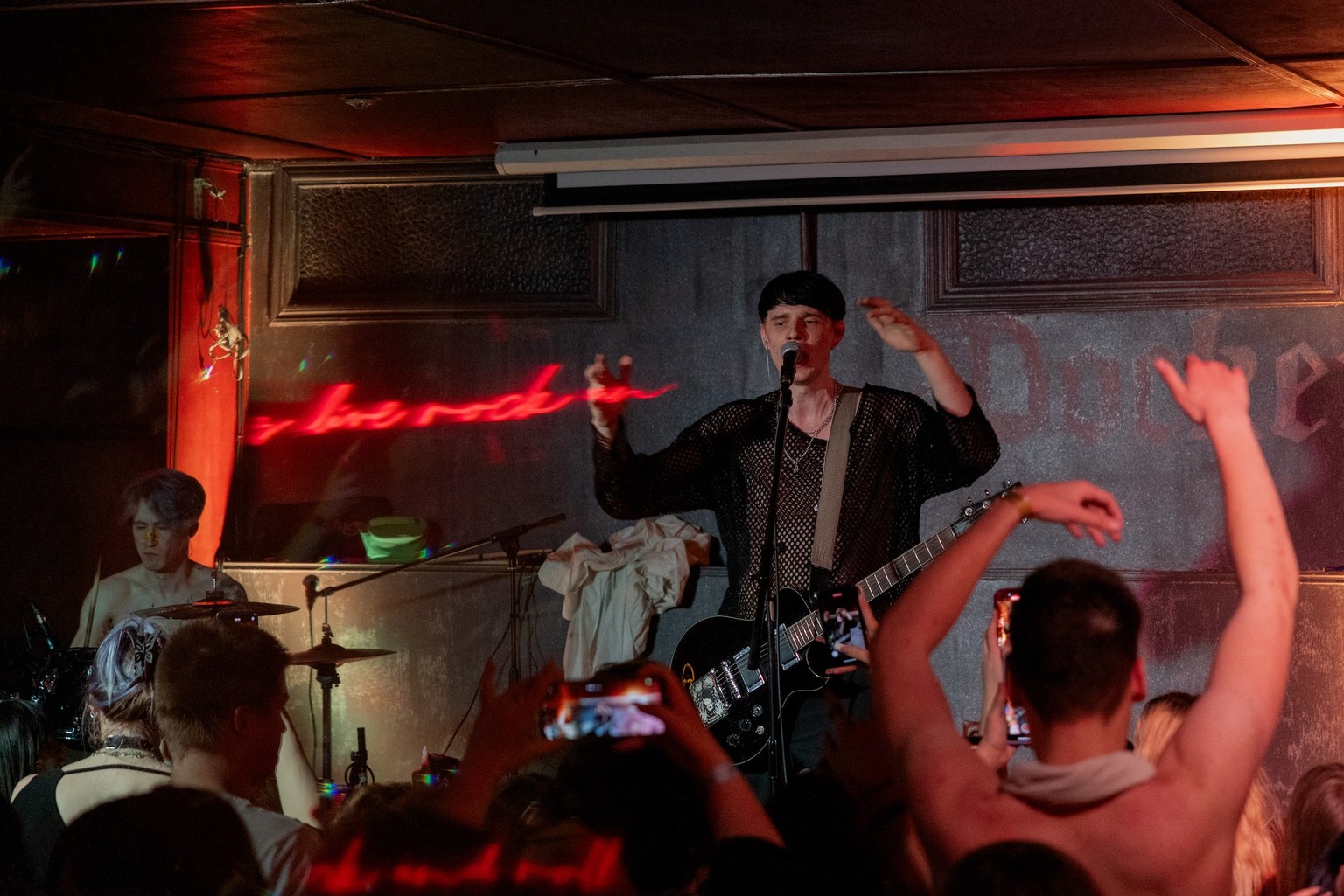 Members of the punk-rock band Susidy Sterpliat, drummer Oleksandr Pavlov and guitarist Artur Zubarevof perform in a pub in Vinnytsia, on March 22, 2025, amid the Russian invasion of Ukraine. The duo,  ...
