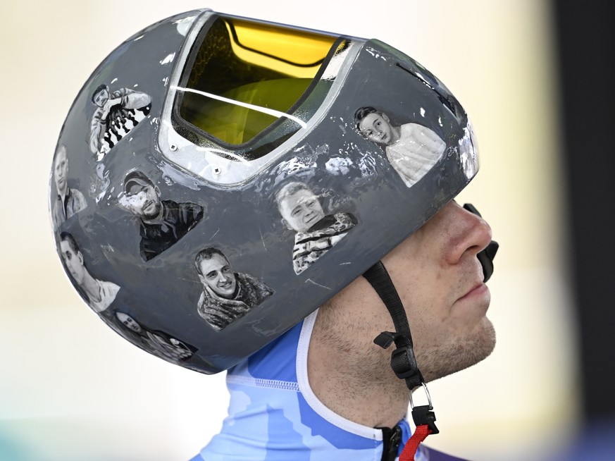 epa12726801 Vladyslav Heraskevych of Ukraine wears a helmet in memory of the Ukrainian athletes who died in the war during the Men's Skeleton training session at the Milano Cortina 2026 Winter Ol ...