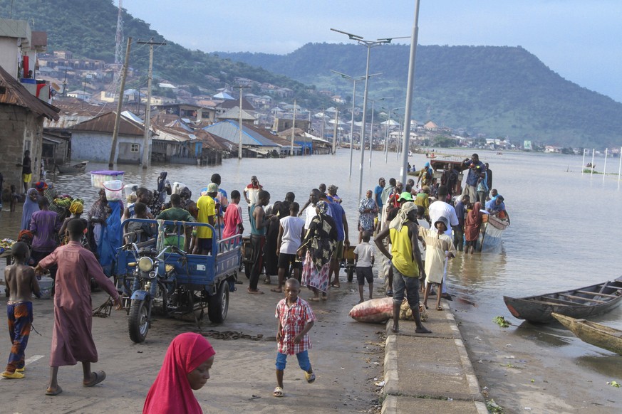 People stranded due to floods following several days of downpours In Kogi Nigeria, Thursday, Oct. 6, 2022. Thousands of travelers remained stranded in Nigeria&#039;s northcentral Kogi state after majo ...