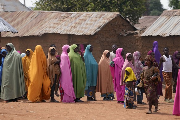 FILE - Parents wait for news about the kidnapped LEA Primary and Secondary School Kuriga students in Kuriga, Kaduna, Nigeria, on March 9, 2024. Nearly 300 schoolchildren abducted from their school in  ...
