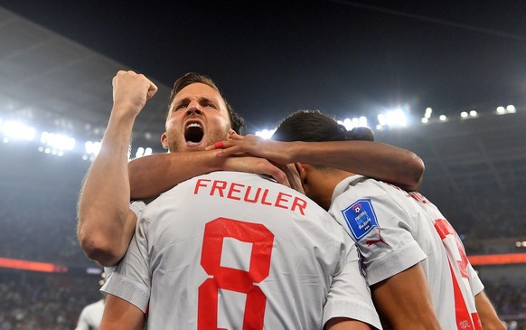 epa10345209 Remo Freuler of Switzerland celebrates scoring the 3-2 with teammates during the FIFA World Cup 2022 group G soccer match between Serbia and Switzerland at Stadium 947 in Doha, Qatar, 02 D ...