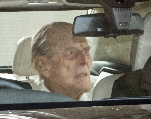 The Duke of Edinburgh (centre) is driven away in a car after leaving the King Edward VII&#039;s Hospital, London, where he has been recovering after heart surgery. Picture date: Tuesday March 16, 2021 ...