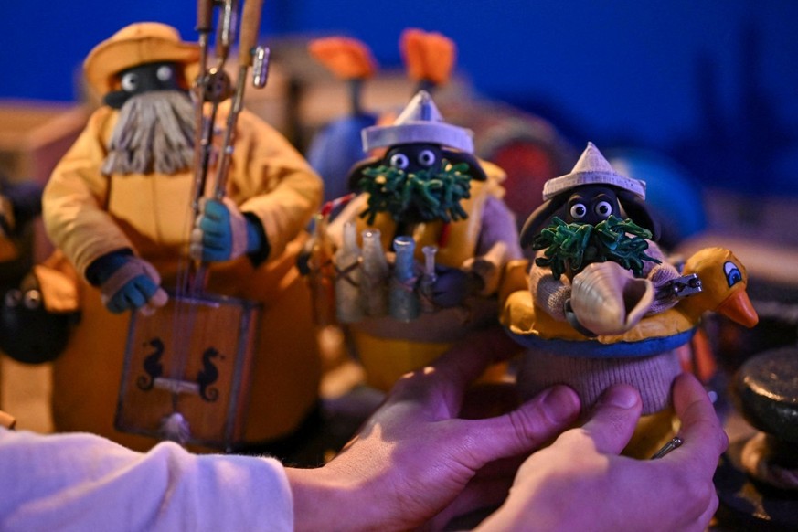 This photo taken on March 4, 2026 shows models for 'Shaun the Sheep: The Beast of Mossy Bottom' at Aardman Animations studios in Bristol, western England. In the basement of the Bristol-base ...