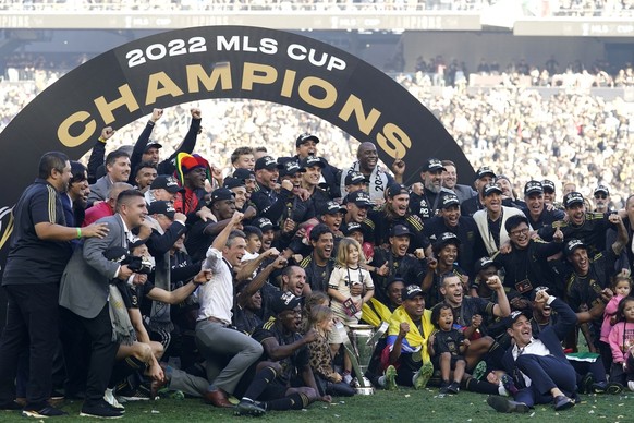 Los Angeles FC players and staff celebrate after defeating the Philadelphia Union in a penalty kick shootout to win the MLS Cup soccer match Saturday, Nov. 5, 2022, in Los Angeles. (AP Photo/Marcio Jo ...