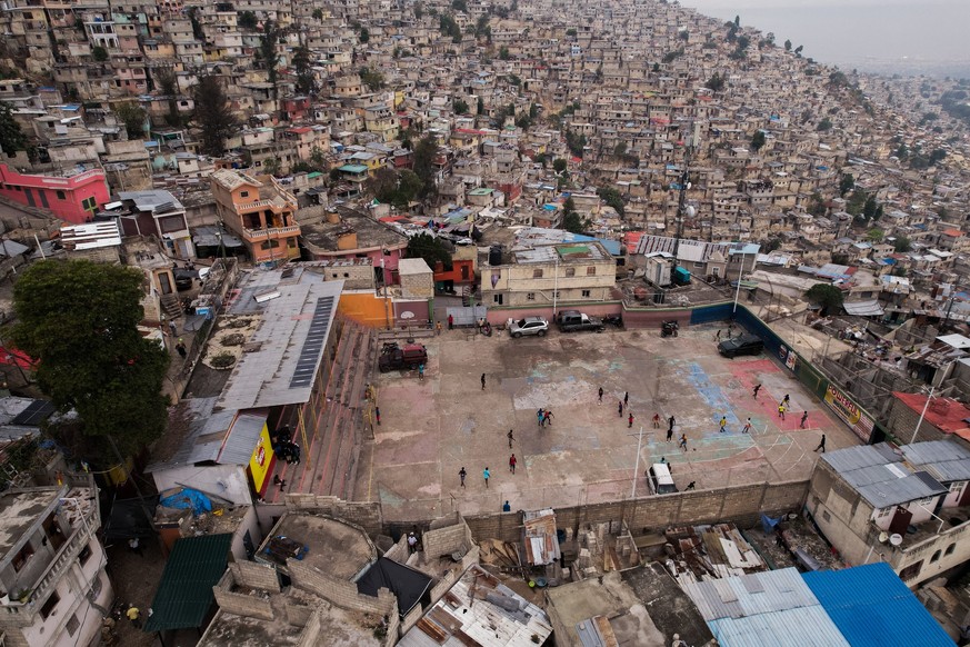Children play football in Jalouzi, Port-au-Prince, Haiti, on March 21, 2026. (Photo by Clarens SIFFROY / AFP)