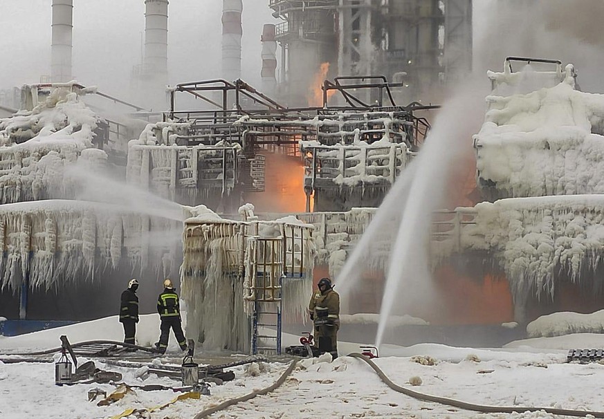 epa11094936 A handout photo made available by the Telegram Channel of head of the Kingisepp district administration Yuri Zapalatskiy, shows firefighters trying to extinguish a fire at the NOVATEK gas  ...