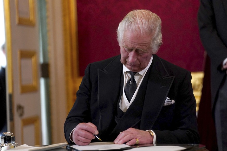 King Charles III signs an oath to uphold the security of the Church in Scotland during the Accession Council at St James&#039;s Palace, London, Saturday, Sept. 10, 2022, where King Charles III is form ...