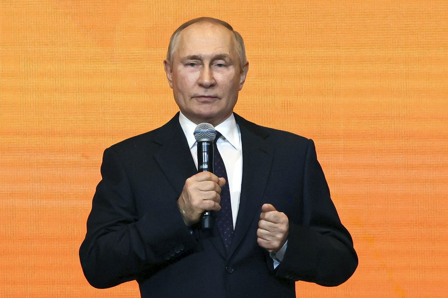 Russian President Vladimir Putin delivers his speech during the #WeAreTogether volunteer forum at the Manezh Central Exhibition Hall in Moscow, Russia, Monday, Dec. 5, 2022. (Vitaliy Belousov, Sputnik ...