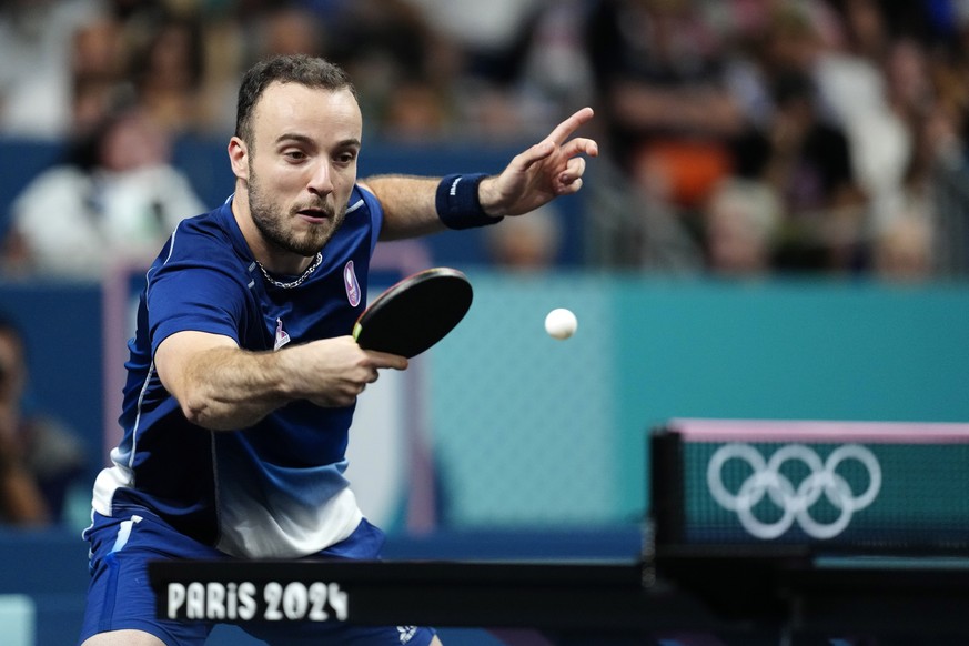 France&#039;s Simon Gauzy plays against Japan&#039;s Tomokazu Harimoto during the men&#039;s bronze medal team table tennis match at the 2024 Summer Olympics, Friday, Aug. 9, 2024, in Paris, France. ( ...
