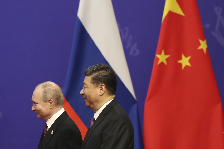 FILE - In this April 26, 2019, file photo, Russian President Vladimir Putin, left, and Chinese President Xi Jinping, right, attend an event at the Friendship Palace in Beijing. Putin and Xi have devel ...