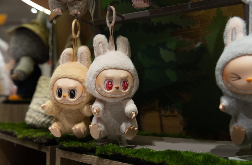 epa12180681 Labubu dolls are displayed at a Pop Mart store in Beijing, China, 17 June 2025. Labubu is a Nordic-inspired character and collectible plush toy designed by Hong Kong designer Kasing Lung.  ...