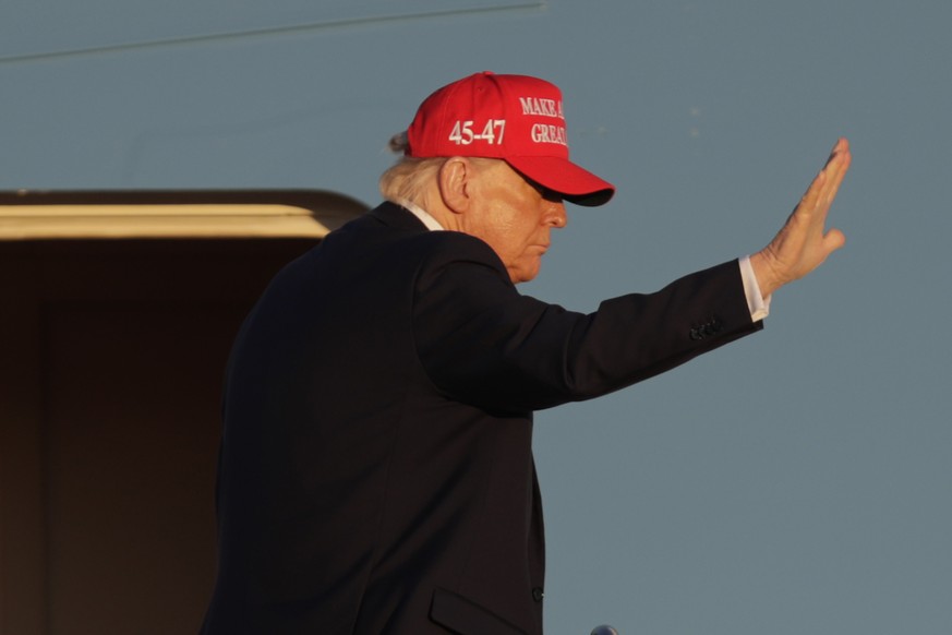 President Donald Trump waves as he boards Air Force One, Friday, Feb. 28, 2025, at Joint Base Andrews, Md. (AP Photo/Luis M. Alvarez)
Trump