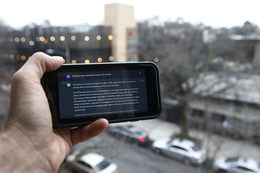 A ChatGPT prompt is shown on a device near a public school in Brooklyn, New York, Thursday, Jan. 5, 2023. New York City school officials started blocking this week the impressive but controversial wri ...