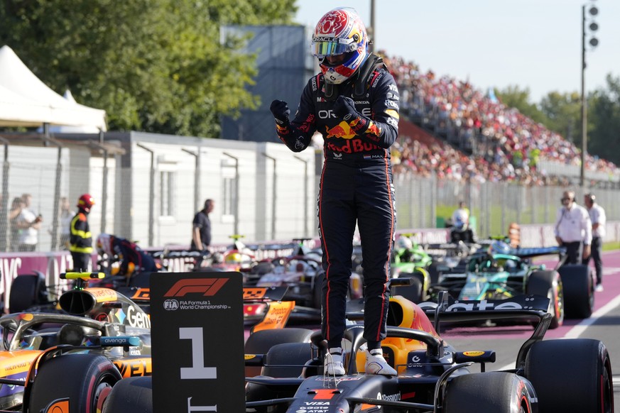 Red Bull driver Max Verstappen of the Netherlands celebrates his pole position after the qualifying session ahead of the Italian Grand Prix at the Monza racetrack in Monza, Italy, Saturday, Sept. 6, 2 ...