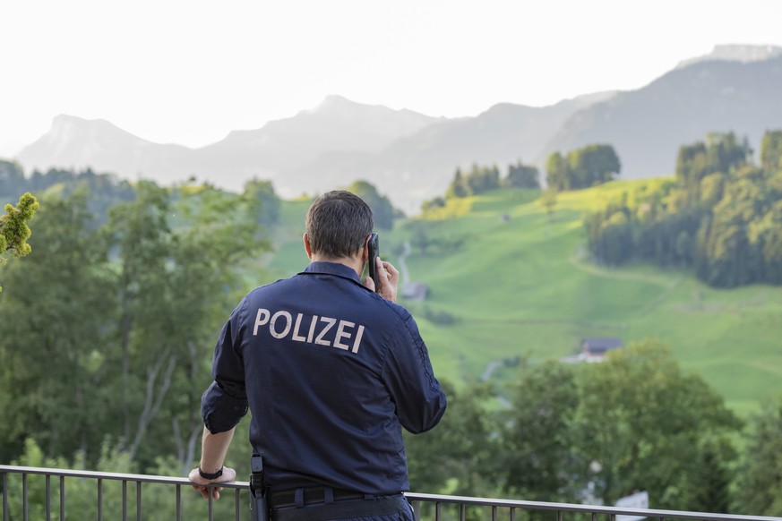 epa13053462 A Swiss police officer patrols at the Buergenstock resort in Obbuergen, Switzerland, 21 June 2026. After the signing of a framework agreement on peace in France this week the delegations o ...