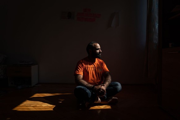 BELGRADE, SERBIA - SEPTEMBER 8: Mansoor Adayfi, former Guantanamo detainee from Yemen, is photographed at his apartment wearing an orange shirt with the number he was given while he was detained on it ...