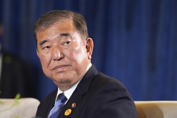 Prime Minister of Japan Shigeru Ishiba sits during a trilateral meeting with President Joe Biden and the President of South Korea Yoon Suk Yeol in Lima, Peru, Friday, Nov. 15, 2024. (AP Photo/Manuel B ...