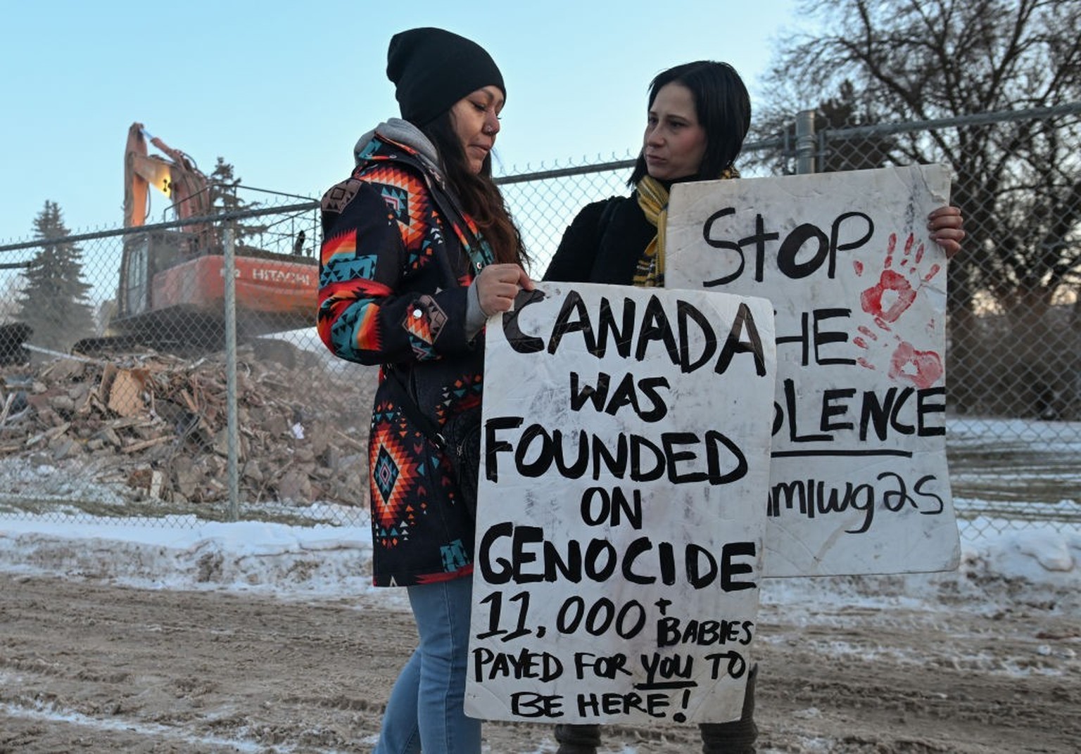 EDMONTON, CANADA - DECEMBER 28:
Advocates for the missing and murdered Indigenous women (MMIW) hold placards outside Edmonton&#039;s Atonement Home during a flash rally by the demolition site of the f ...