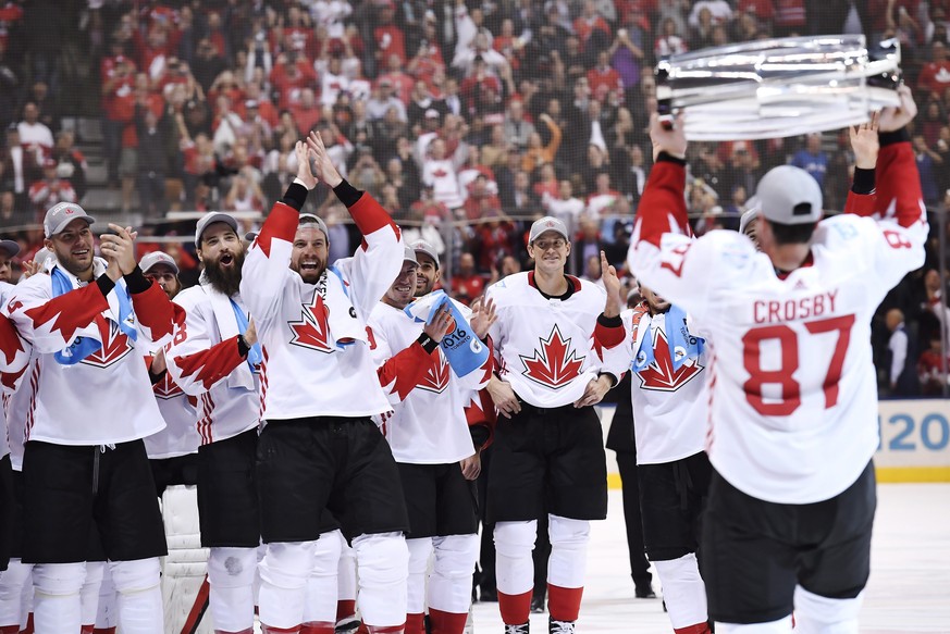 FILE - Canada&#039;s Sidney Crosby (87) hoists the trophy in front of teammates following Canada&#039;s 2-1 victory over Europe in Game 2 of the final to win the World Cup of Hockey, in Toronto, Sept. ...