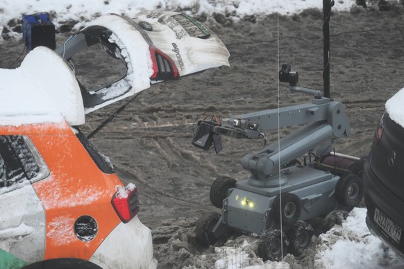Russia General Kirillov Blast Death 8829736 17.12.2024 A bomb defusing robot is seen at a scene of an explosion in which Lieutenant General Igor Kirillov, the head of the Troops of Radiological, Chemi ...
