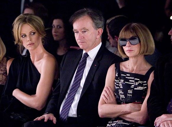 Charlize Theron, Bernard Arnault and Anna Wintour (Photo by Brian Ach/WireImage)