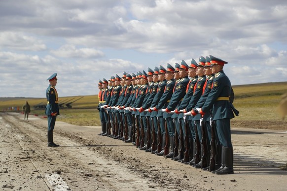 FILE - In this Thursday, Sept. 13, 2018 file photo a Russian honor guard prepares to take a part in a parade prior to a military exercises on training ground &quot;Tsugol&quot;, about 250 kilometers ( ...