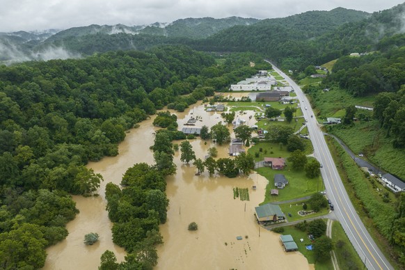 Home and structures are flooded near Quicksand, Ky., Thursday, July 28, 2022. Heavy rains have caused flash flooding and mudslides as storms pound parts of central Appalachia. Kentucky Gov. Andy Beshe ...