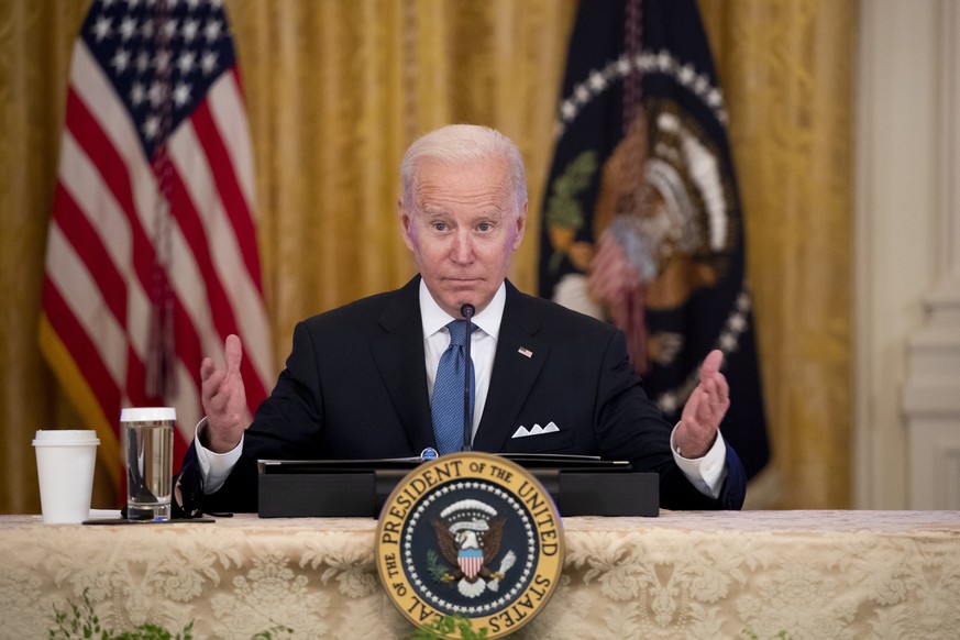 epa09707192 US President Joe Biden participates in a meeting with the White House Competition Council in the East Room of the White House in Washington, DC, USA, 24 January 2022. The meeting was held  ...