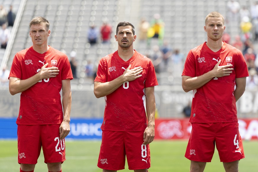 Switzerland's Michel Aebischer, Remo Freuler and Nico Elvedi, from left, sing the national anthem prior to a friendly soccer match between Switzerland and Australia at the Snapdragon Stadium in S ...