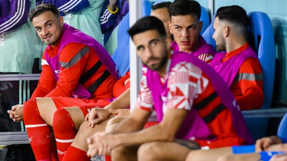 Switzerland&#039;s midfielder Xherdan Shaqiri, left, reacts on the bench during the FIFA World Cup Qatar 2022 group G soccer match between Brazil and Switzerland at the Stadium 974, in Doha, Qatar, Mo ...