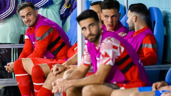 Switzerland&#039;s midfielder Xherdan Shaqiri, left, reacts on the bench during the FIFA World Cup Qatar 2022 group G soccer match between Brazil and Switzerland at the Stadium 974, in Doha, Qatar, Mo ...