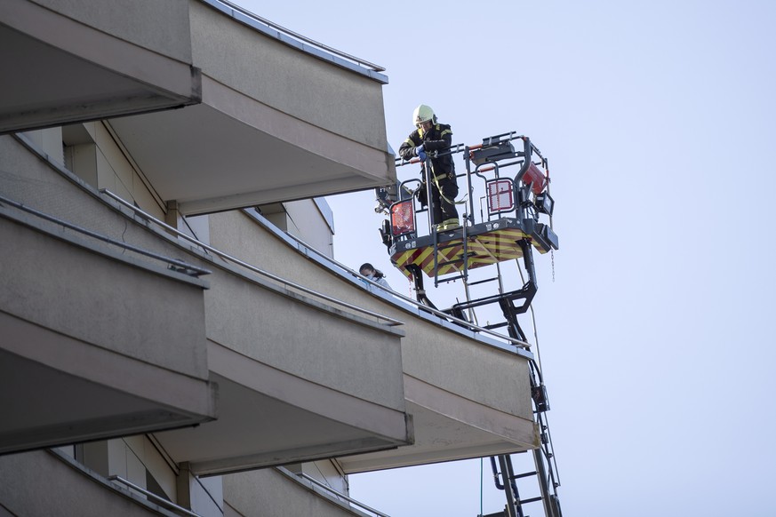 epa09846401 the scene of the tragedy where four people were found dead and one seriously injured at the foot of a building after reportedly falling off, in Montreux, Switzerland, 24 March 2022. The ci ...