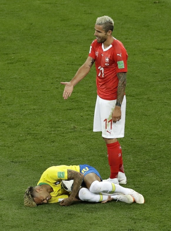 Switzerland&#039;s Valon Behrami reacts as Brazil&#039;s Neymar lies on the ground during the group E match between Brazil and Switzerland at the 2018 soccer World Cup in the Rostov Arena in Rostov-on ...