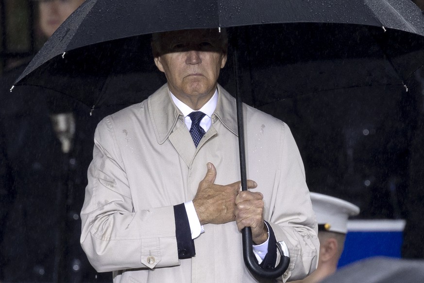 epa10177956 US President Joe Biden observes the playing of ?�Taps?� during an observance ceremony for the 21st anniversary of the 9/11 attacks, at the Pentagon in Arlington, Virginia, USA, 11 Septembe ...