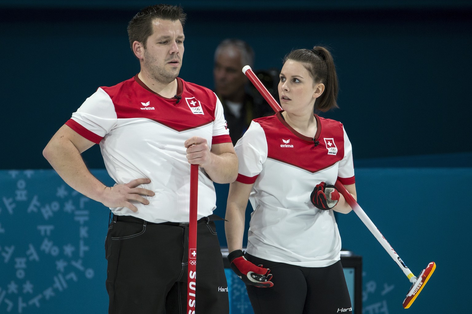 Martin Rios of Switzerland and Jenny Perret of Switzerland, from left, during the Mixed Doubles Curling semi final game between Switzerland and Olympic Athletes from Russia during the XXIII Winter Oly ...