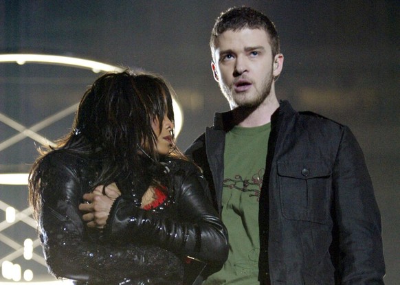HOUSTON, TX - FEBRUARY 1: Singers Janet Jackson and surprise guest Justin Timberlake perform during the halftime show at Super Bowl XXXVIII between the New England Patriots and the Carolina Panthers a ...