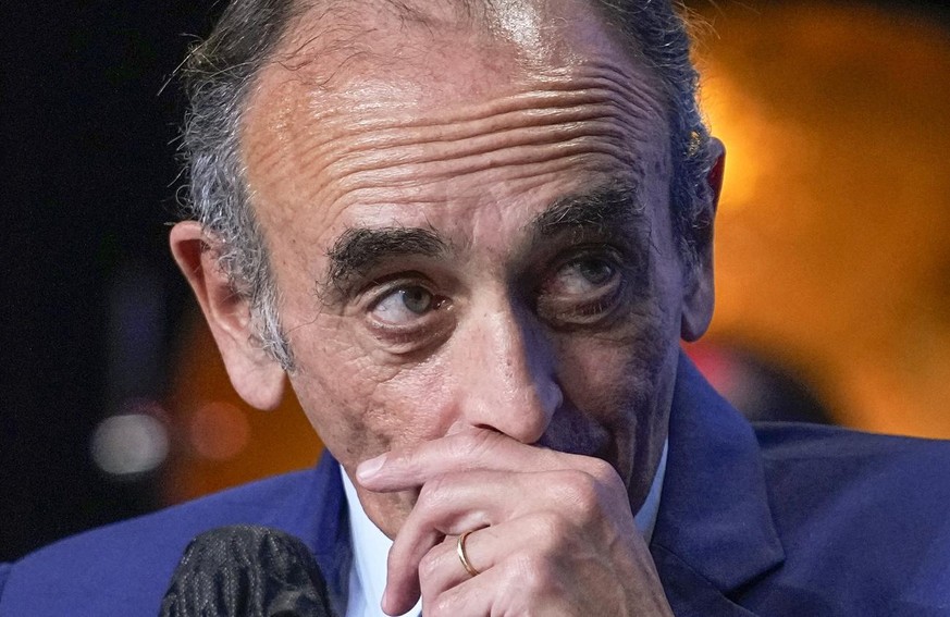 FILE - In this Oct.19, 2021 file photo, Eric Zemmour listens during a meeting to promote his latest book &quot;La France n&#039;a pas dit son dernier mot&quot; (France has not yet said its last word)  ...