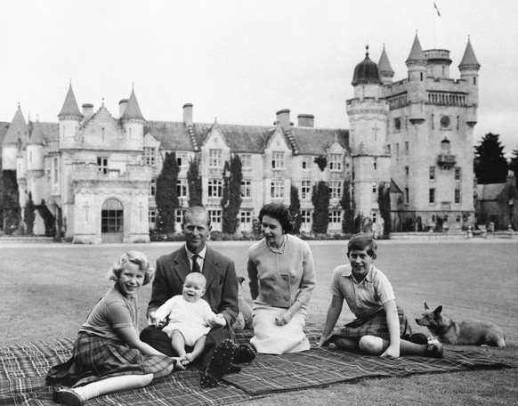 FILE - In this Sept. 1960, photo, Britain&#039;s Queen Elizabeth II, Prince Philip and their children, Prince Charles, right, Princess Anne and Prince Andrew, pose for a photo on the lawn of Balmoral  ...
