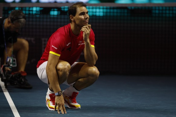 epa11730095 Rafa Nadal of Spain reacts during a tribute received after the Spanish doubles match against the Netherlands during the Davis Cup quarterfinal between Netherlands and Spain at the Jose Mar ...