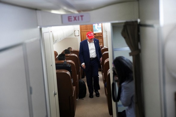 U.S. President Donald Trump walks on board Air Force One on the way to New Jersey, U.S., July 4, 2025. REUTERS/Nathan Howard