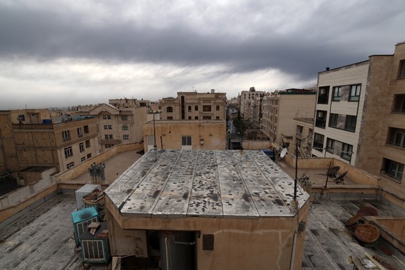 The roof of a house is seen covered with soot after overnight strike on the Tehran Oil Refinery in Tehran on March 8, 2026. The United States and Israel hit five oil facilities with overnight strikes  ...