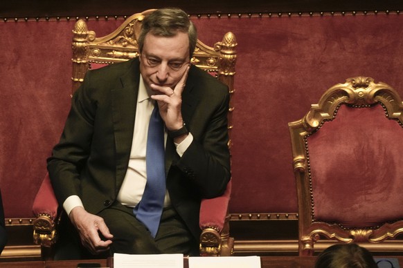 Italian Premier Mario Draghi attends a debate at the Senate in Rome, Wednesday, July 20, 2022. Draghi was deciding Wednesday whether to confirm his resignation or reconsider appeals to rebuild his par ...