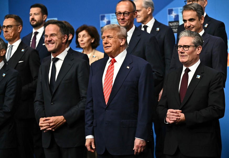 NATO Secretary General Mark Rutte, from left, President Donald Trump and Britain&#039;s Prime Minister Keir Starmer pose with NATO country leaders for a family photo during the NATO summit in The Hagu ...