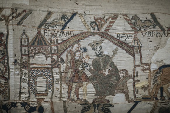 FILE - This file photo taken, Sept. 18, 2019 shows a detail of the 11th century Bayeux tapestry chronicling the Norman conquest of England, in Bayeux, Normandy, France. (AP Photo/Kamil Zihnioglu, File ...