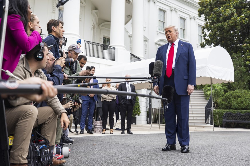 epa12178058 US President Donald Trump speaks to the media as he departs the White House for Alberta, Canada, where he will attend the G7 Summit, in Washington, DC, USA 15 June 2025. Trump answered que ...