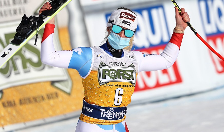 epa09038060 Winner Lara Gut-Behrami of Switzerland celebrates in the finish area after the Women's Downhill race at the FIS Alpine Skiing World Cup in Val di Fassa, Italy, 26 February 2021. EPA/A ...